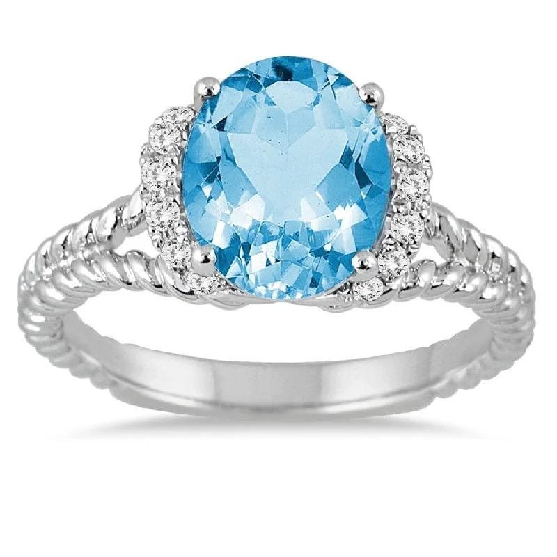 Women’s birthstone ring-2 1/4 Carat Oval Blue Topaz and Diamond Ring in 14K White Gold